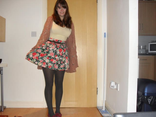 Floral skirt with pink cardigan outfit
