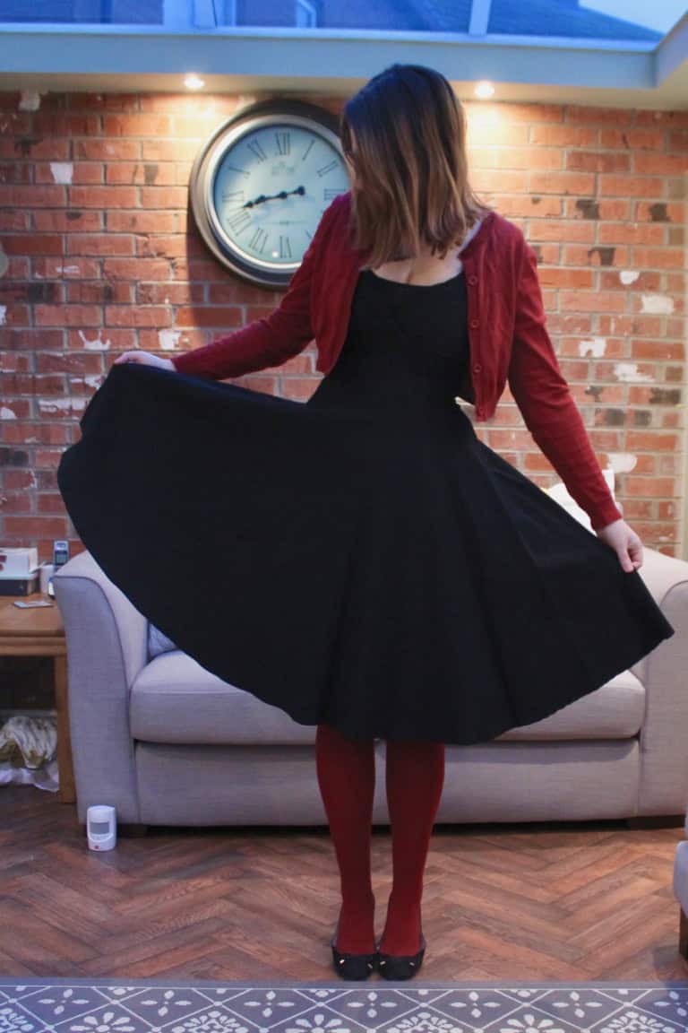 Collectif dress with red tights & cardigan