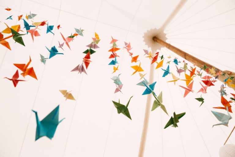 Origami Cranes in sailcloth marquee at Newburgh Priory wedding