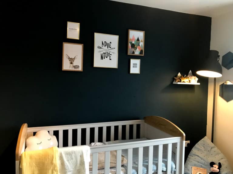 Adventure & nature inspired girl's nursery with woodland, forest & mountain elements - a wanderlust nursery with navy wall